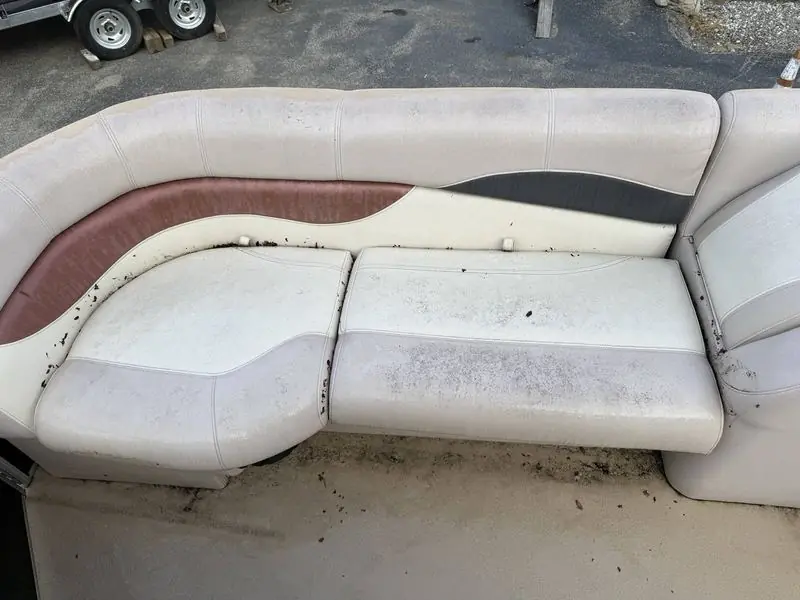 Pontoon bench seating before detailing, dirty and stained