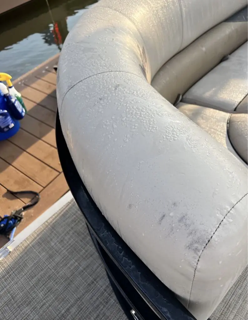 Pontoon bench seating before detailing, dirty and stained