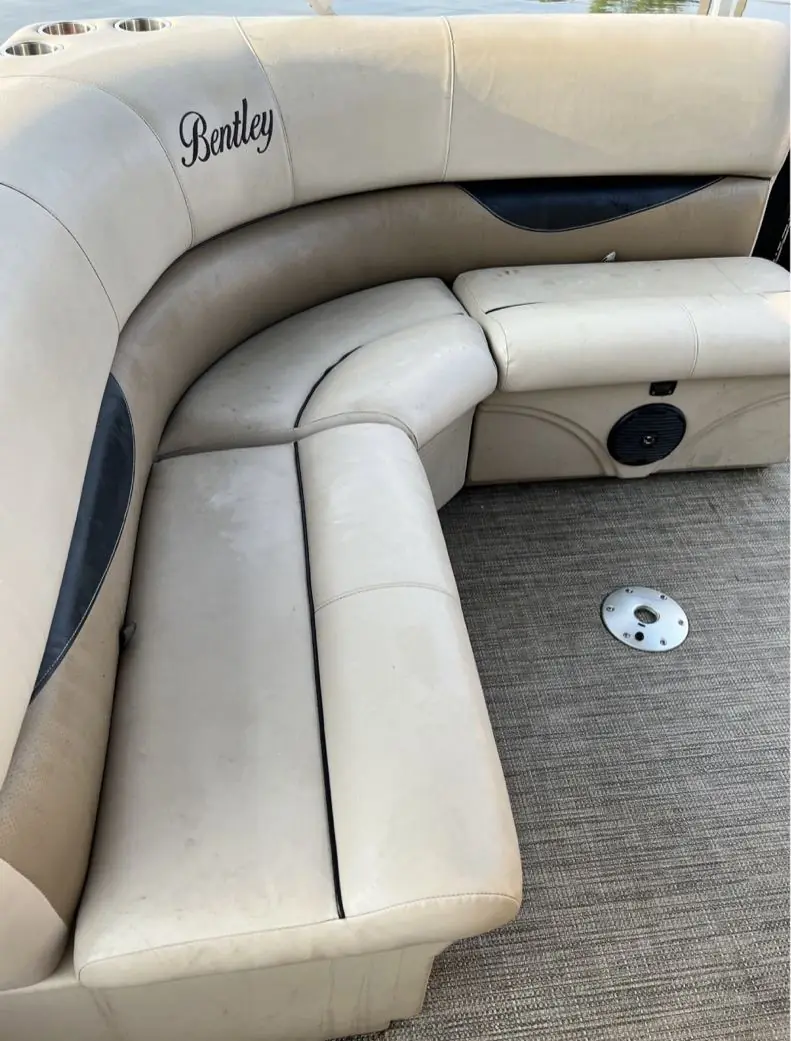 Pontoon corner bench before detailing, dirty vinyl