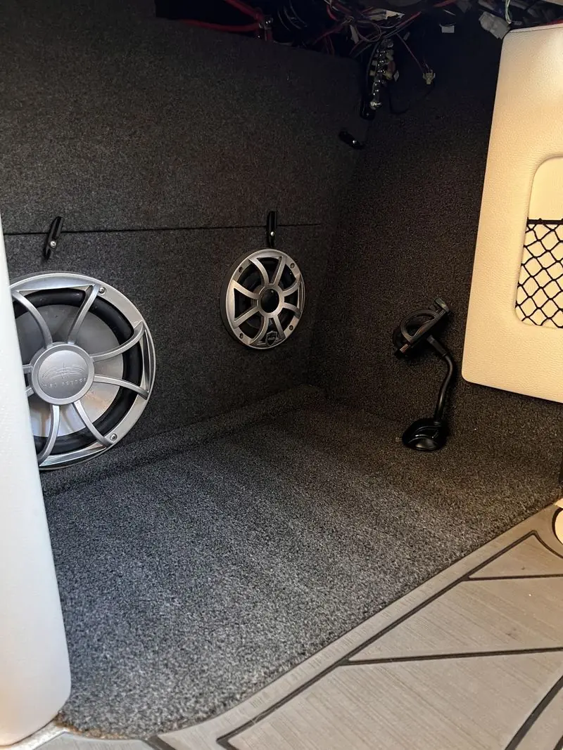 The same compartment after detailing, clean carpet